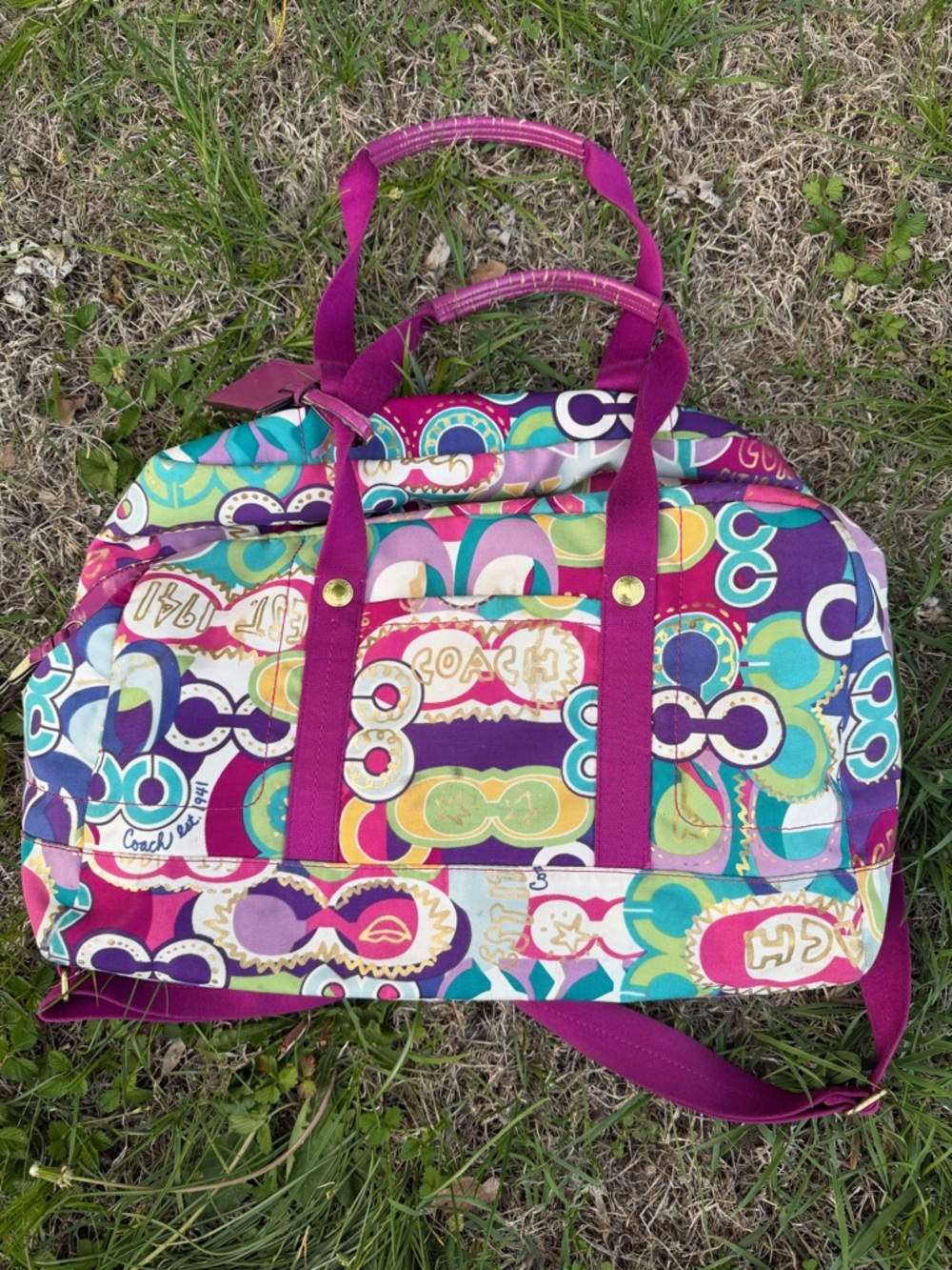 Coach Signature weekend bag with Fuchsia Accents